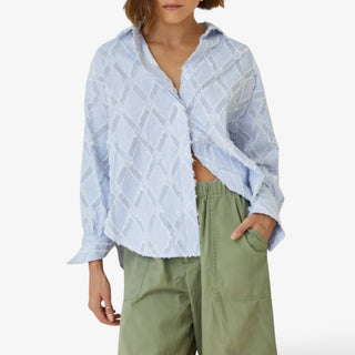 Blue striped button down shirt with textured fringe detail and oversized fit front view