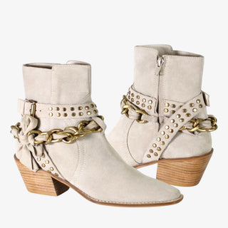 Paper Lily by Diba True beige suede ankle boots with studded strap, gold chain detail, side buckle, and stacked wooden heel.