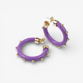 Small purple and gold hoops on a light grey background
