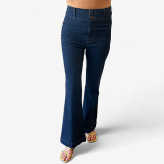 Dark denim high rise jeans with double button front and flare legs on a white background.