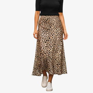 Person wearing a leopard print skirt on a white background