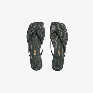 Pair of dark emerald green flip-flops with a textured crocodile pattern on a white background