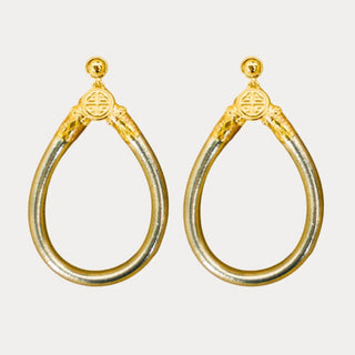 BudhaGirl Etoile All Weather Earrings featuring a metallic gold teardrop silhouette with gold-tone details, front view on white background