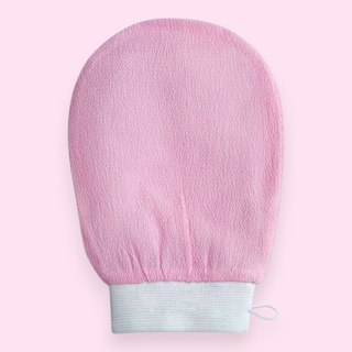 Pink exfoliating glove on a pink background