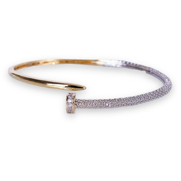 Nail motif bangle with silver and gold accents. Open design ensures ease of taking on and off.