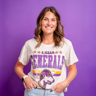 Woman wearing a LSUA 'Generals' t-shirt with a purple background