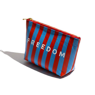 Freedom Tyvek cosmetic bag with gold zipper top angled product view