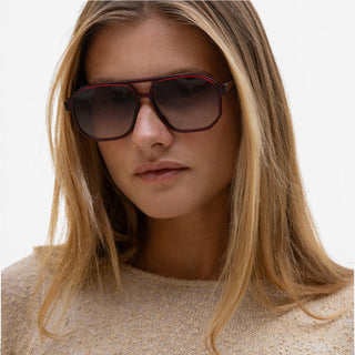 Dark Cherry aviator sunglasses on blonde model with oversized frame and gradient brown lenses front view