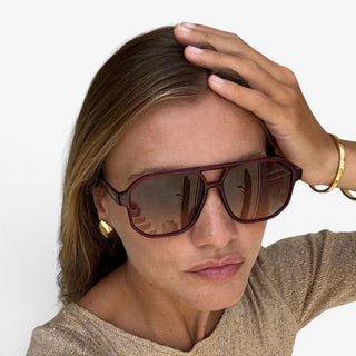 FREYRS Billie Dark Cherry aviator sunglasses on model with oversized frame and gradient brown lenses lifestyle view