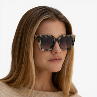 Freyrs Coco milky tortoise square sunglasses worn by model with brown gradient lenses and oversized designer frame lifestyle view