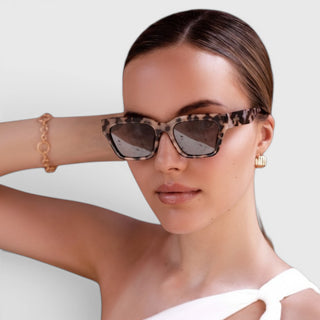 FREYRS Hayden rectangular sunglasses on woman with tortoise frame and brown lenses lifestyle view