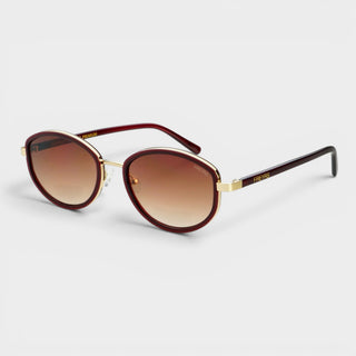FREYRS Jordan oval sunglasses with burgundy frame and brown gradient lenses angled view