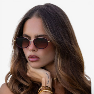 FREYRS Jordan oval sunglasses with burgundy frame and brown gradient lenses worn by model lifestyle