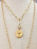 The Kitzi CZ Cross is a 14" gold paperclip style necklace, with a 2" pendant of a raised 3D cross. 