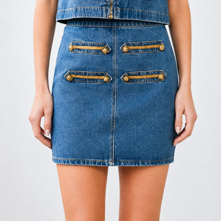 Gold Button Detail Denim Skirt close-up showing braided gold trim, button accents, front seam and medium blue denim texture