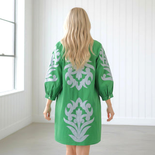 Bold Green Appliqué Dress with long sleeves and relaxed silhouette back view