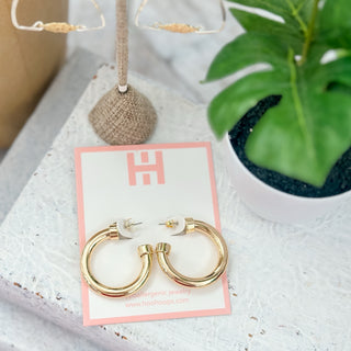 Hoo Hoops gold hoop earrings small chunky acrylic hoops on pink jewelry card with tropical styled background