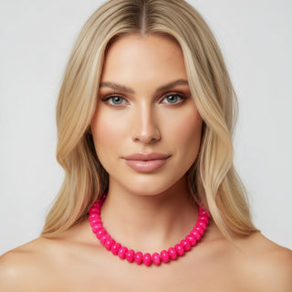 Hot pink chunky bead necklace, glossy round bead fashion jewelry, close-up front view