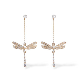 Gold dragonfly drop earrings with pearl studs and crystal accents hanging from delicate chains