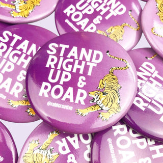 Stand Right Up & Roar Button in purple with white lettering and a tiger graphic 
