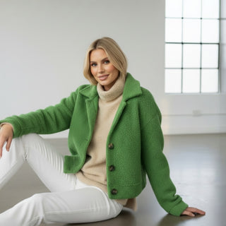 Green boucle cropped jacket with oversized collar and textured fabric seated styling view