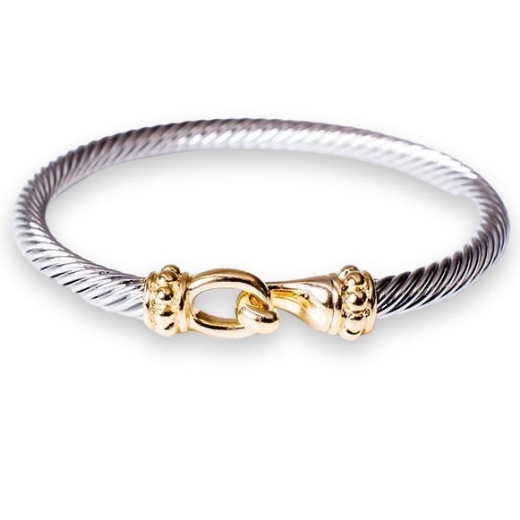 Silver and gold mixed metal hook bracelet, versatile and trendy accessory.