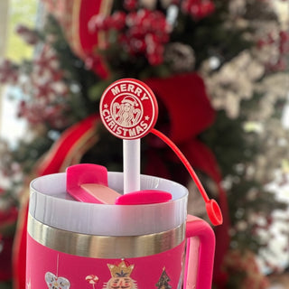 Christmas straw topper on pink holiday tumbler with Merry Christmas design in front of Christmas tree