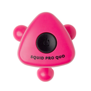 Pink triangular device with 'SQUID PRO QUO' branding on a white background
