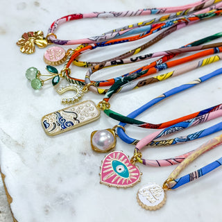 Silk Cord Charm Wrap shown as bracelet and necklace with assorted charms