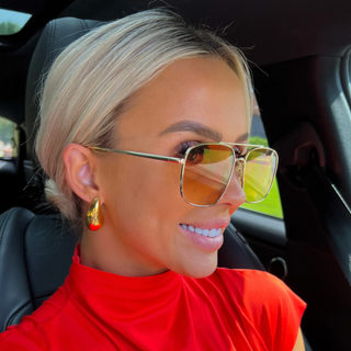 Lauren gold teardrop earrings in 18K gold plated stainless steel worn on model