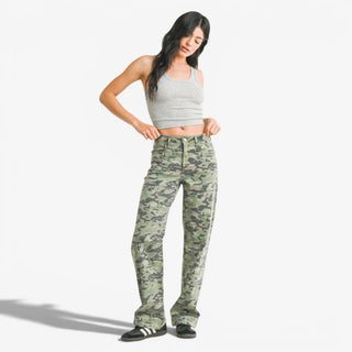 Camo relaxed fit pants with wide leg fit and green camouflage print side view on model