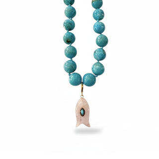 Turquoise fish charm necklace with turquoise bead necklace and fish pendant, coastal statement jewelry, front view on white background