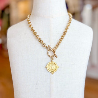 Kitzi Gold Coin Necklace with chunky gold chain, front toggle closure and vintage-inspired round coin pendant, front display view