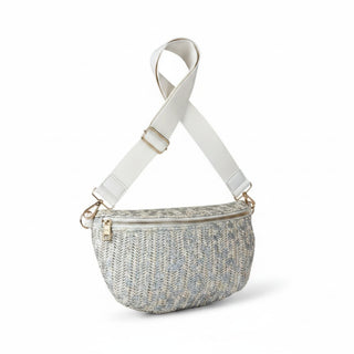Cream raffia leopard crossbody bag with metallic silver animal print, gold hardware and adjustable strap on a white background