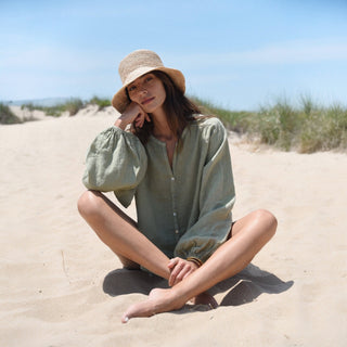     Light green linen button down blouse with relaxed fit and split neckline outdoor view