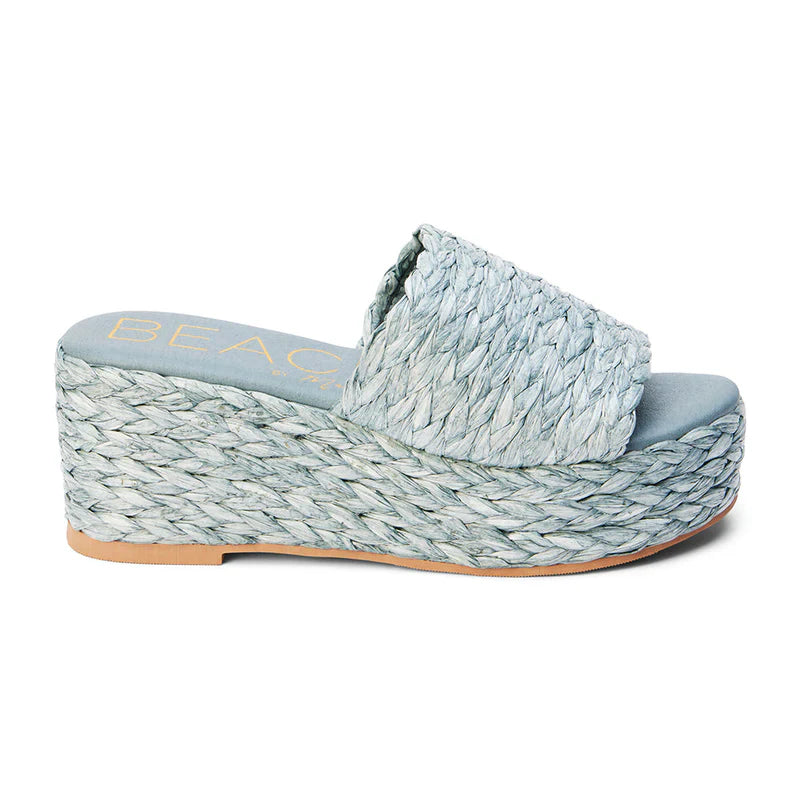 Matisse Beach Peony Sandal in slate blue, slip on style with a raffia strap and padded insole for cushion.. 