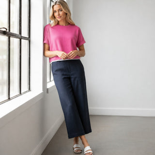 Wide leg navy herringbone linen pants in Nocturnal angled front view with side pockets