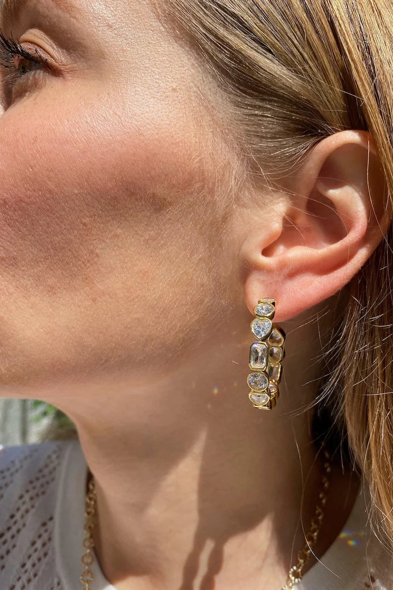 14k gold vermeil hoop earrings with mixed round CZs and emerald-cut CZs.
