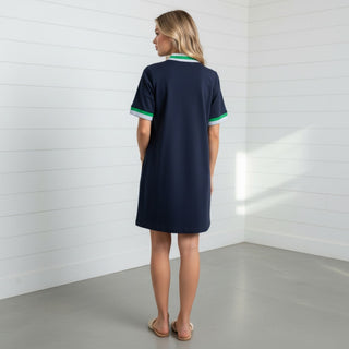 Navy shift dress back view with short sleeves and straight relaxed fit in minimal studio setting
