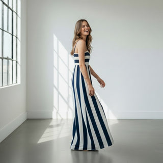 navy striped maxi dress side angle smiling model effortless vacation outfit