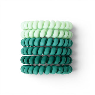 Green ombre spiral hair ties in mint and emerald green shades front view