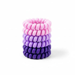 Purple ombre spiral hair ties in pink, lavender, and purple shades front view