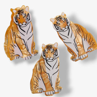     Pearlescent sitting tiger hair claw clip showing multiple angles with marbled acetate detail and secure clasp