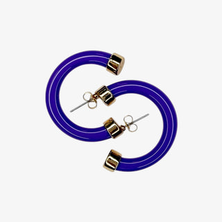 Purple mini hoop earrings with gold accents on a white background