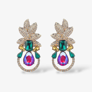 Gold statement earrings with crystal-studded leaves, emerald green stones, yellow accents, and large iridescent teardrop gems in a circular rhinestone frame.