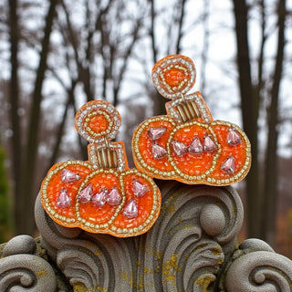 Orange beaded pumpkin earrings with rhinestone accents and gold trim