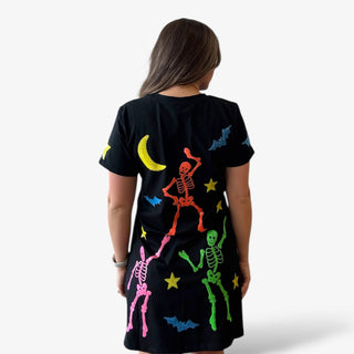 Black dress with colorful skeleton and moon designs on a plain background