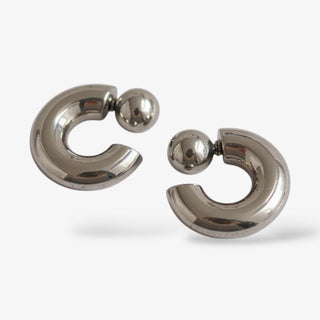 Pair of silver hoop earrings on a white background