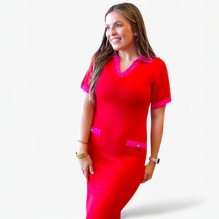 Red knit midi dress with pink trim on collar, sleeves, and pockets styled on a woman against a clean white background.