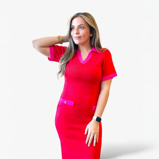 Red knit midi dress with pink trim on collar, sleeves, and pockets styled on a woman against a clean white background.